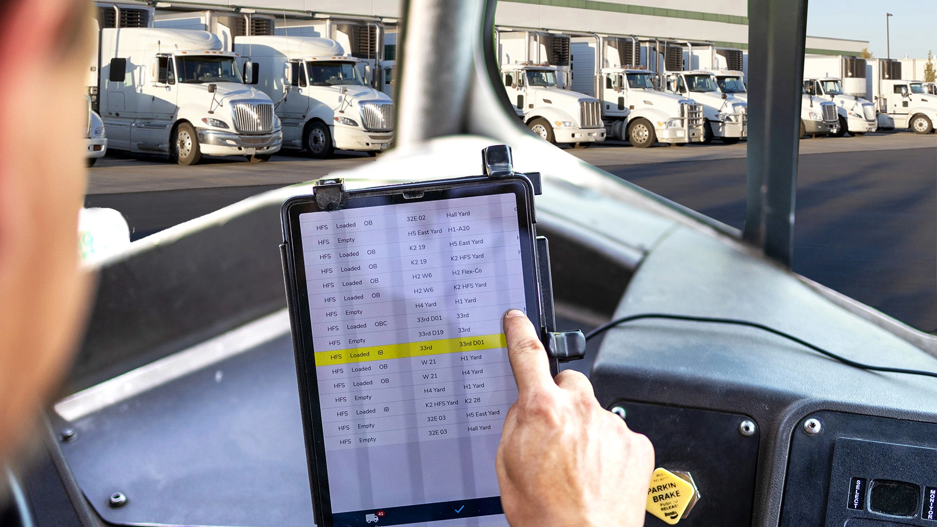 Yard manager using tablet to access digital yard map